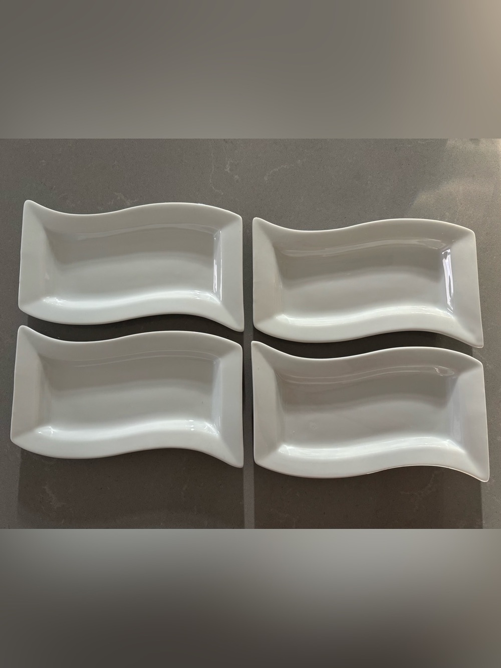 set of 4 Pier one 1 Wavy white porcelain serving dishes